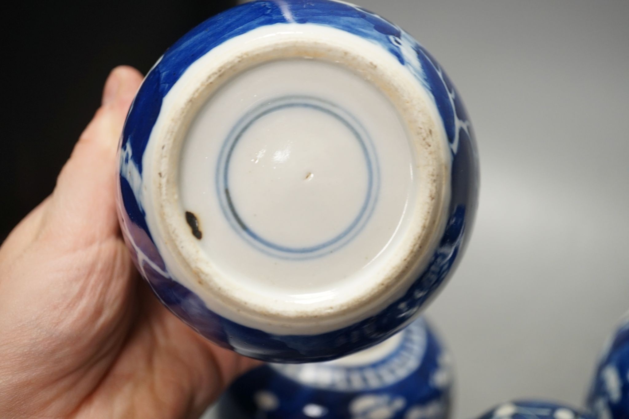 A pair of Chinese blue and white vases and eleven jars, six with covers., Vase and matching cover 28 cms high.